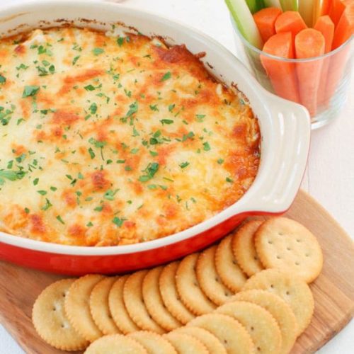 1. Preheat oven to 350°F. 2. Mix all ingredients together in a bowl and spread out into a shallow baking dish. 3. Bake for 20-25 minutes, until warm and bubbly. 4. Stir the dip and serve immediately with crackers, celery, and carrot sticks.